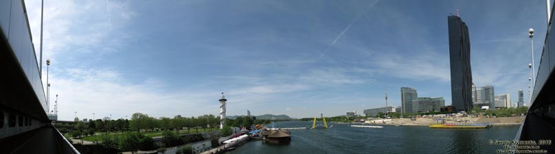 Вена (Vienna), Австрия (Austria). Фото. Вид от станции метро «Donauinsel»: рукав Новый Дунай (Neue Donau),
слева - остров «Donauinsel», справа - застройка «Donau City» и «UNO-City». Панорама ~180°.