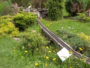 Photo of the Carpathians, Ivano-Frankivsk region. Yaremche. Park-Museum “Carpathians in Miniature”. Stone railroad bridge - viaduct (1894).