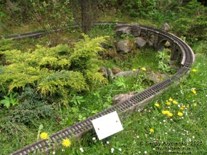 Photo of the Carpathians, Ivano-Frankivsk region. Yaremche. Park-Museum “Carpathians in Miniature”. Railway and stone railway bridge - viaduct (1894).