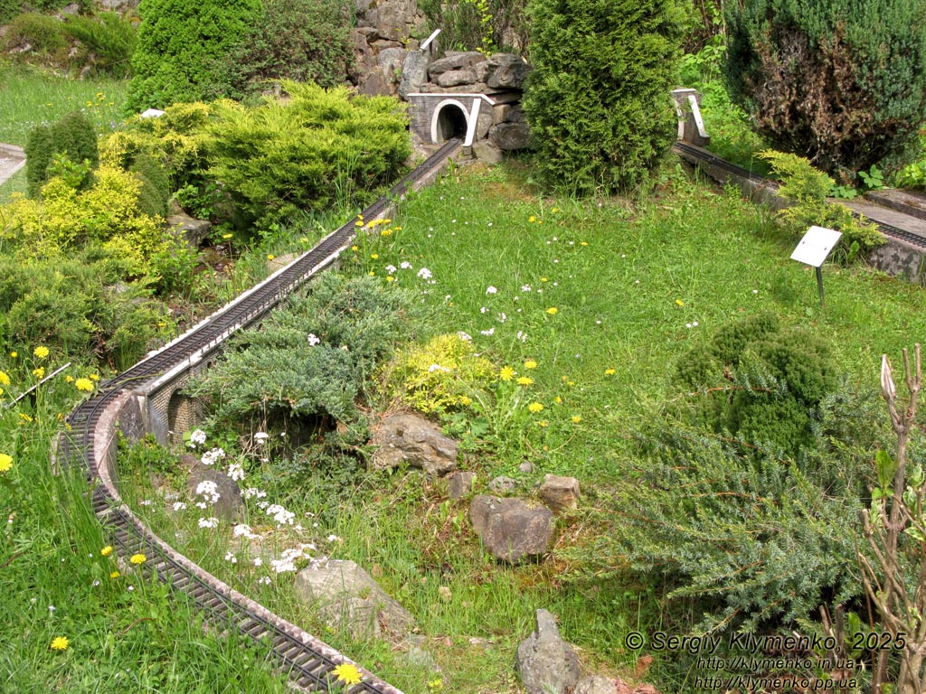 Photo of the Carpathians, Ivano-Frankivsk region. Yaremche. Park-Museum “Carpathians in Miniature”. Railway and stone railway bridge - viaduct (1894).
