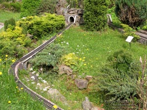 Photo of the Carpathians, Ivano-Frankivsk region. Yaremche. Park-Museum “Carpathians in Miniature”. Railway and stone railway bridge - viaduct (1894).